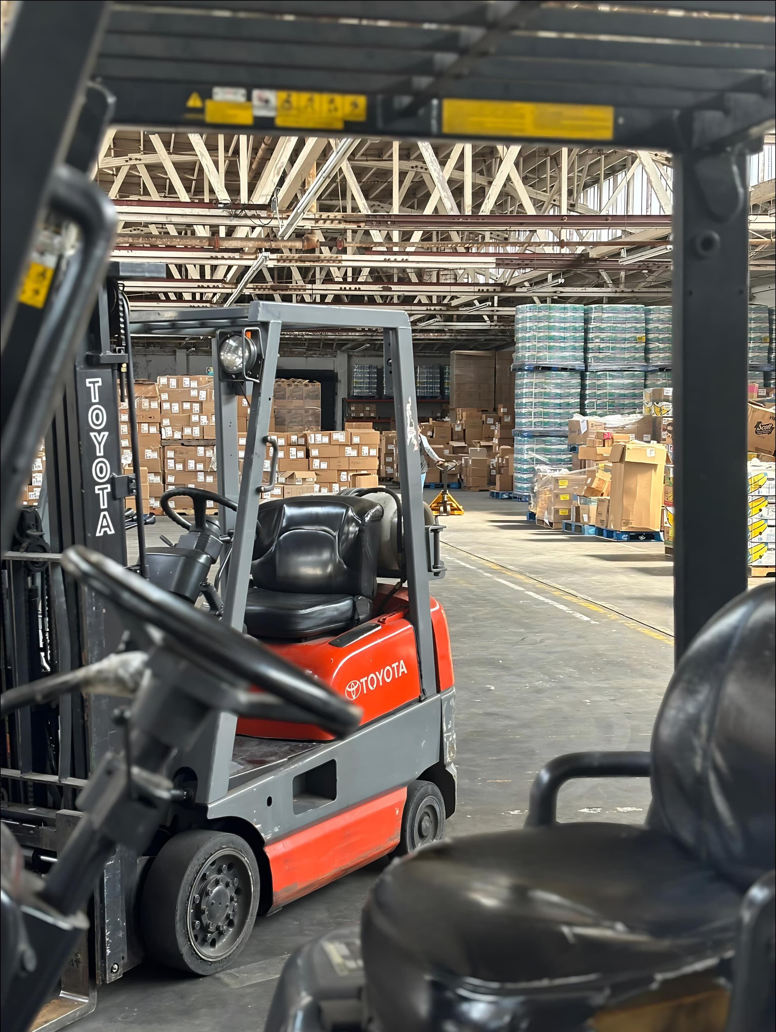 A warehouse worker sorting through makeup